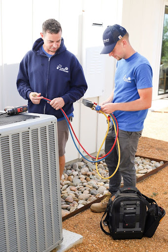 AC & Heat Solutions technician troubleshooting heat pump problem in Coppell